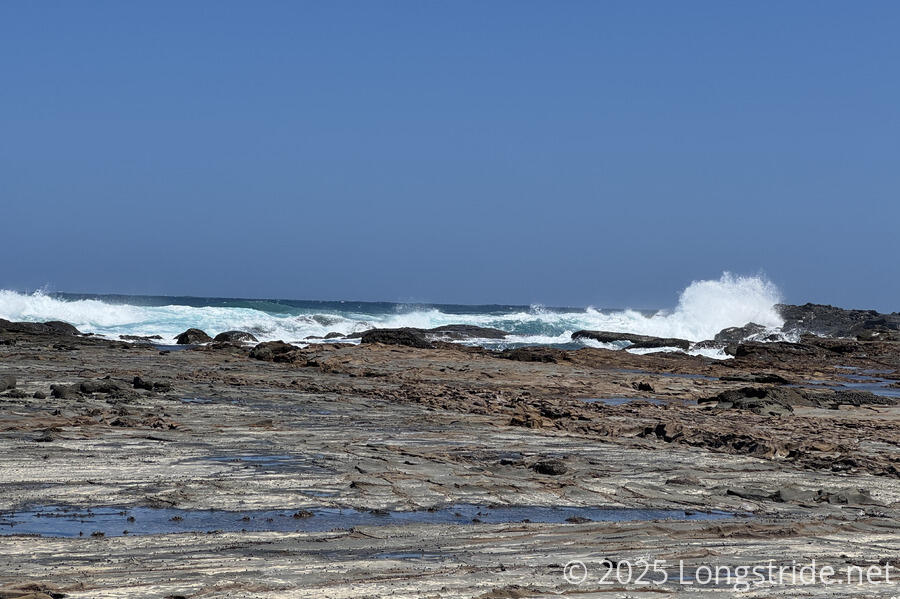 Waves Crash on the Rocks